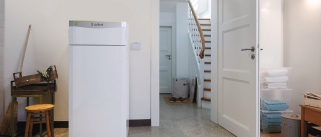 ground-source heat pump in a house with a door open