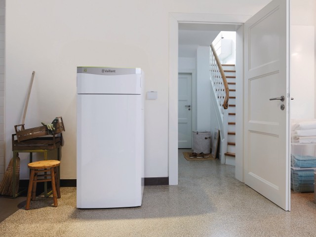 ground-source heat pump in a house with a door open