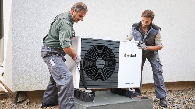 two installers fitting an aroTHERM plus heat pump