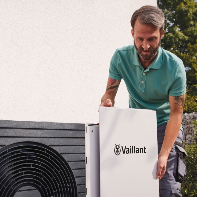 installer putting the front of a vaillant heat pump